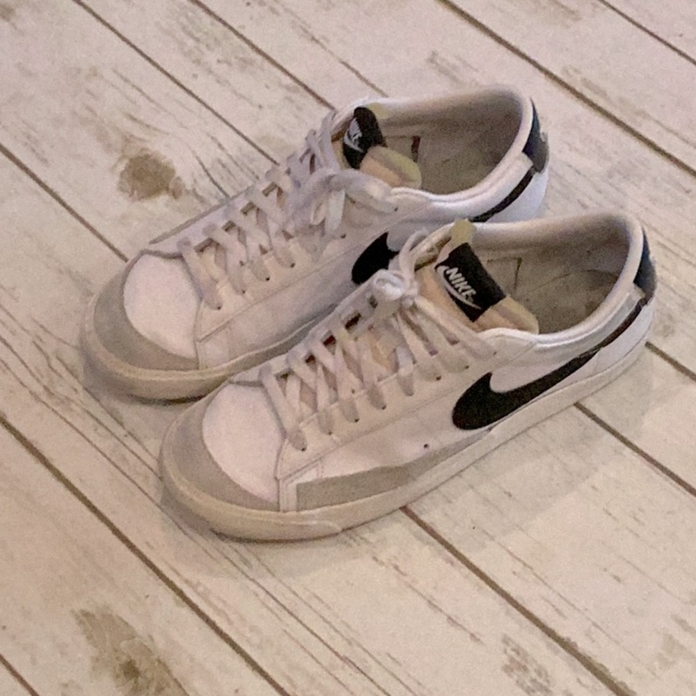 Nike Blazer low women’s 11, men’s 9.5 White and Black Sneakers